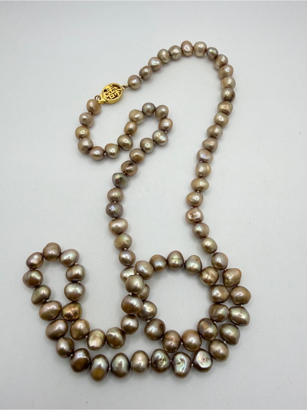 28" champagne colored Freshwater pearl necklace w/ gold tone Good Fortune clasp!